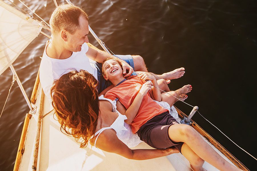 Personal Insurance - Excited Family Hanging Out on a Boat